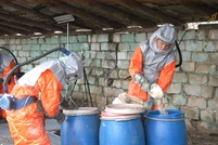 National Army Servicemen Repack Pesticides in Clocusna